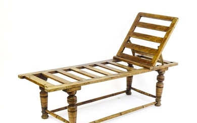 A late 19thC 'Leveson & Sons' campaign bed /day bed with a s...