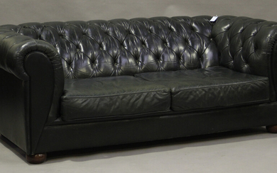 A late 20th century buttoned green leather Chesterfield settee, height 71cm, width 202cm, depth 93cm