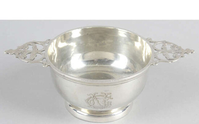 A late Victorian silver quaich style bowl with pierced handles.