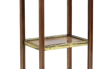 A mahogany and brass bound etagere