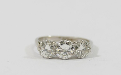 A mid-century platinum and diamond three-stone ring, the rou...