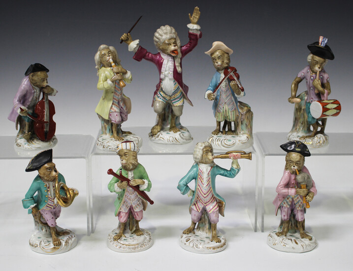 A nine-piece Volkstedt porcelain Meissen style monkey band, early 20th century, comprising eight mus