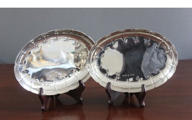 A pair of Elizabeth II Irish-silver oval dishes with scallop...