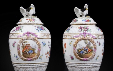A pair of German porcelain Berlin style vases and covers with eagle finials