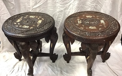 A pair of Indian carved hardwood occasional tables with circular...
