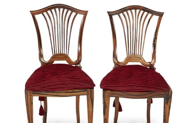 A pair of Regency style cane seat calamander side...