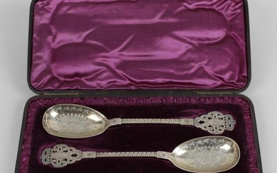 A pair of Victorian silver serving spoons, each ovoid