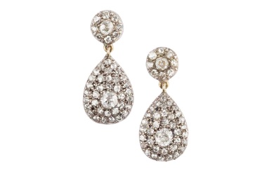 A pair of diamond ear pendants, each designed as a...