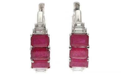 A pair of ruby and diamond ear pendants each set with three emerald-cut rubies and four baguette-cut diamonds, mounted in 14k white gold. (2)