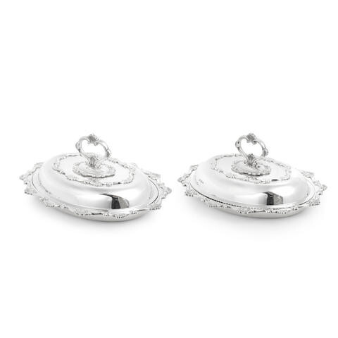 A pair of silver entrée dishes and covers