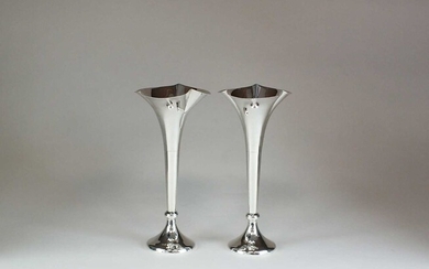 A pair of silver mounted posy vases