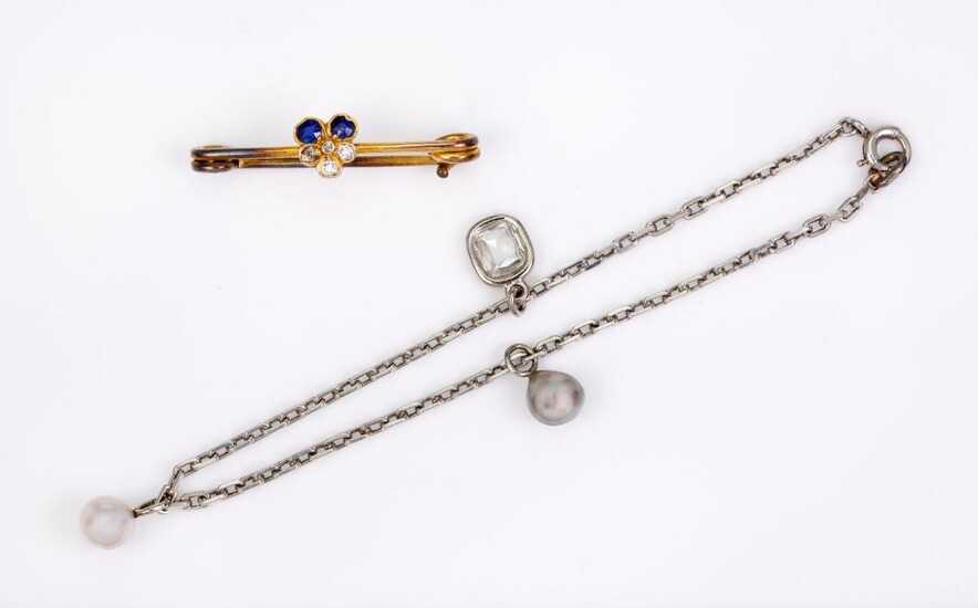 A platinum diamond and cultured pearl bracelet and a sapphire and diamond bar brooch, the bracelet of fine curb linking suspending two cultured pearl drops and a single cushion shaped collet-set diamond, length 18cm, unmarked, the brooch designed...