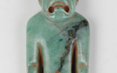 A pre-Columbian Olmec style carved apple green jade figure of a standing male, probably 900-450 BC