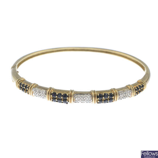 A sapphire and diamond bangle.