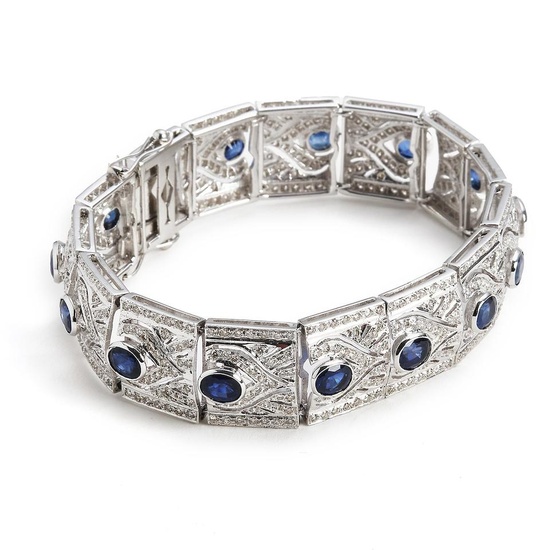 A sapphire and diamond bracelet set with numerous sapphires totalling...