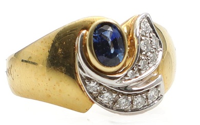 A sapphire and diamond ring set with faceted sapphire flanked by 11...