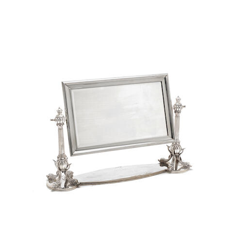 A silver dressing table mirror