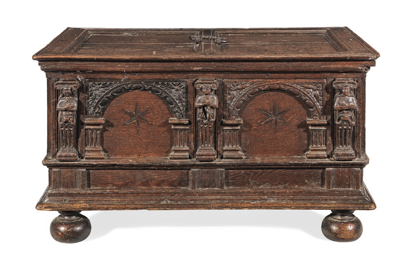A small early 17th century boarded oak chest, Flemish, circa 1600-20