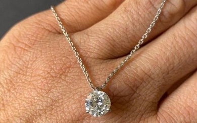 A solitaire pendant with a modern brilliant cut...