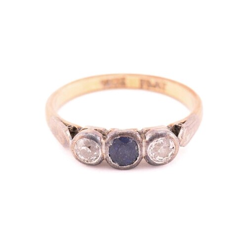 A three-stone ring with sapphire and diamonds, comprises an ...