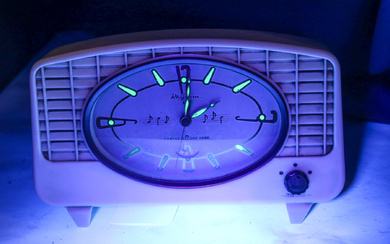 A vintage 'Rhythm' (Tokyo) musical clock, with brilliant green luminescent...