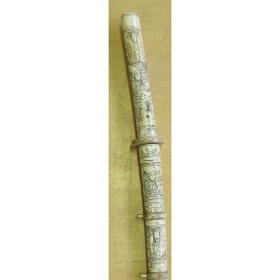 ˜AN IVORY TACHI WITH RELIGIOUS AND SAMURAI CARVINGS