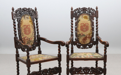 ARMCHAIRS, A PAIR. Wooden oak with cut decoration, textile upholstery, in the back trays with the coat of arms of the family Hamilton. Baroque style, 18th/20th century.
