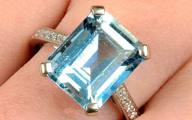 An 18ct gold aquamarine ring, with brilliant-cut diamond line shoulders.