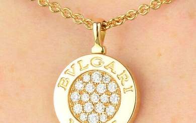 An 18ct gold diamond and onyx 'Roma' reversible pendant on chain, by Bulgari.