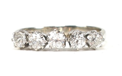 An 18ct white gold and platinum diamond five stone ring. The...