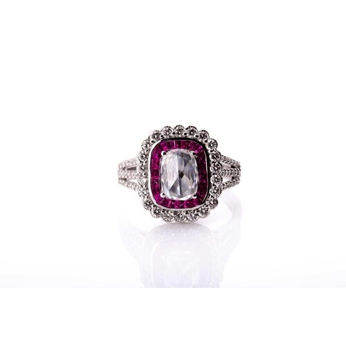 An 18ct white gold, diamond, and ruby cluster ring, set with...