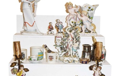 An 18th century Chelsea Derby figural candlestick, Cupid and...