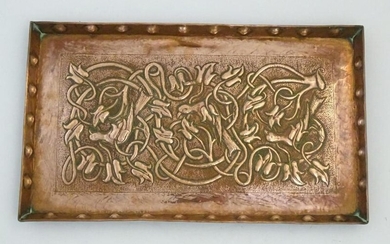 An Arts and Crafts hammered copper tray of rectangular