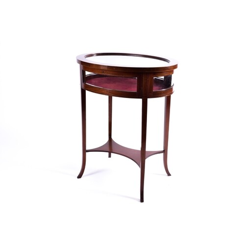 An Edwardian inlaid mahogany oval bijouterie table with out ...