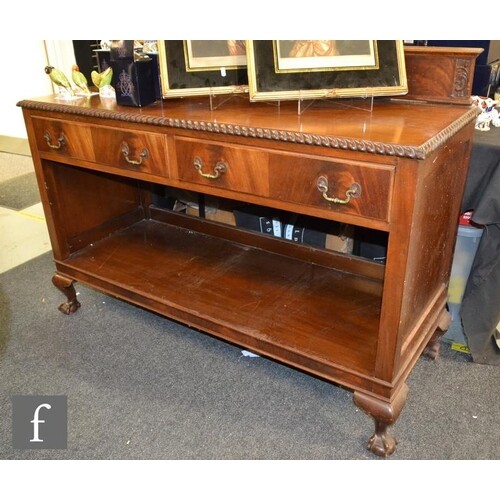 An Edwardian two tier mahogany buffet with gadrooned edge ov...