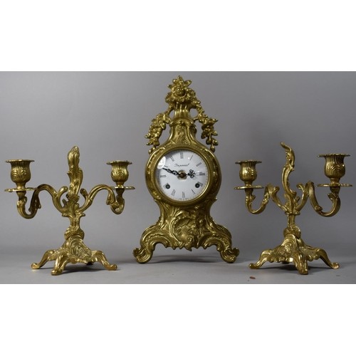 An Italian Brass Clock Garniture with White Enamelled Bell a...