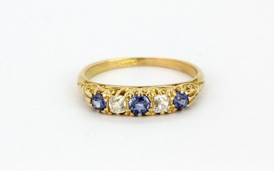 An antique 18ct yellow gold ring set with old cut sapphires and diamonds, (N).