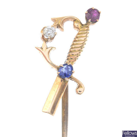 An early 20th century sapphire, ruby and diamond sword stickpin.