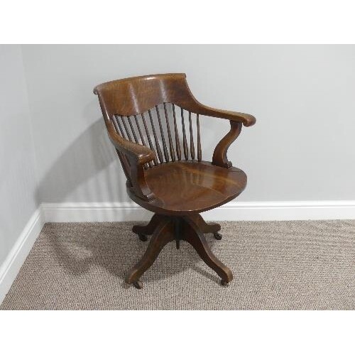 An early 20thC American oak Desk Chair, with cast iron screw...