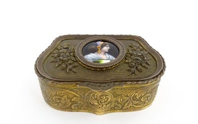 An early 20thC French gilt metal ring box of shaped form wit...