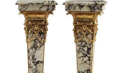 An imposing pair of Louis XVI style gilt metal mounted veined marble pedestals, 20th century