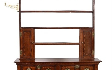 An oak and inlaid dresser