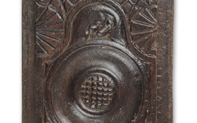 An unusual carved oak panel