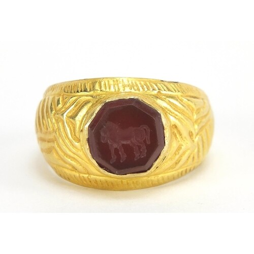 Antique unmarked gold intaglio seal ring carved with a horse...
