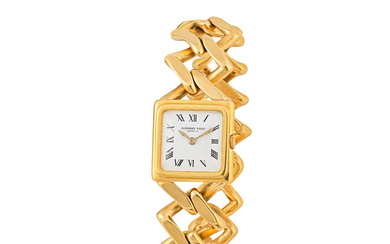 Audemars Piguet. A lady's 18K gold manual wind bracelet watch...