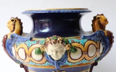 Baluster-shaped vase resting on a round earthenware pedestal...