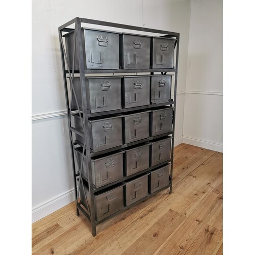 Bank of fifteen metal storage drawers in the industrial styl...