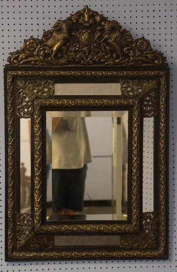 Baroque style pressed metal and wood wall mirror