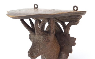 Black Forest carved wall bracket in the form of a goat's hea...