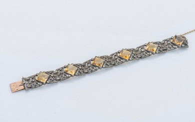 Bracelet in silver (800 thousandths) and 18-carat yellow gold (750 thousandths) composed of 6 medallions decorated with square-cut citrines supported by openwork foliage in a frame enhanced with marcasites.